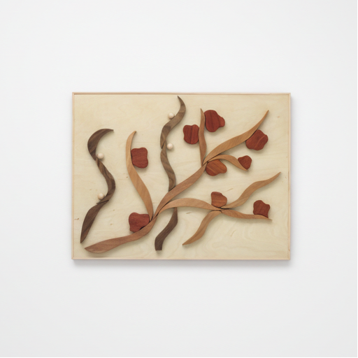 Decorative wall art with abstract rose design on a plain background